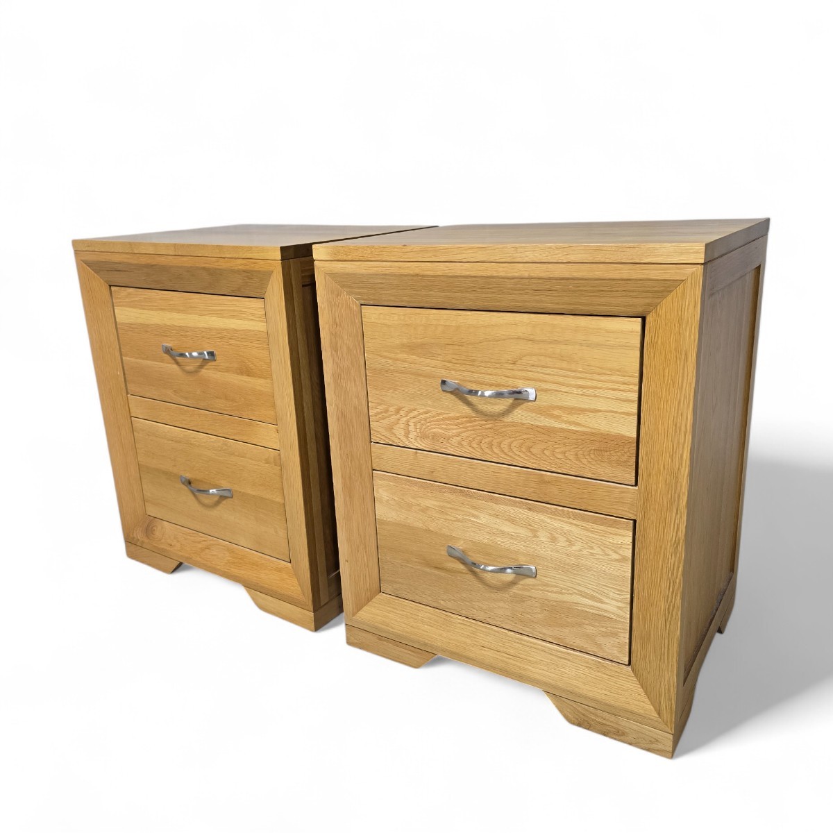 Pair of pre-owned Oak FurnitureLand Bevel bedside drawers in solid oak with brushed metal handles and bevelled frame detailing