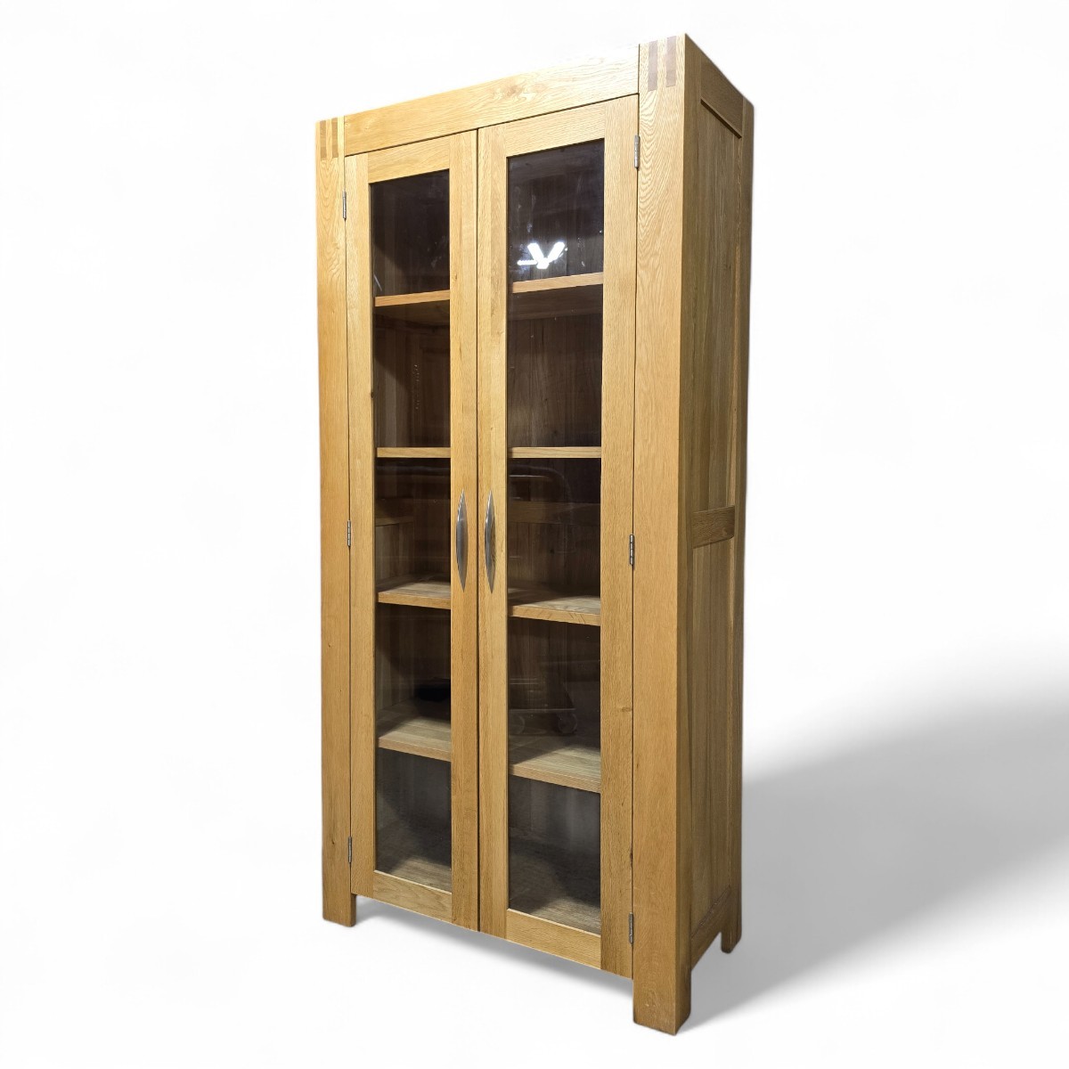 Pre-owned Alto display unit by Oak FurnitureLand showcasing solid oak construction and glass-panelled doors perfect for elegant storage.