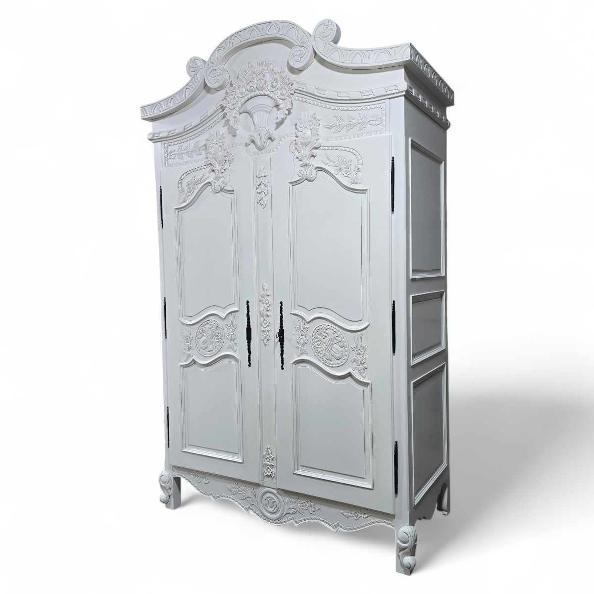 Grand Baroque style wardrobe in white with carved floral motifs and black metal handles available, second hand from Barker and Stonehouse