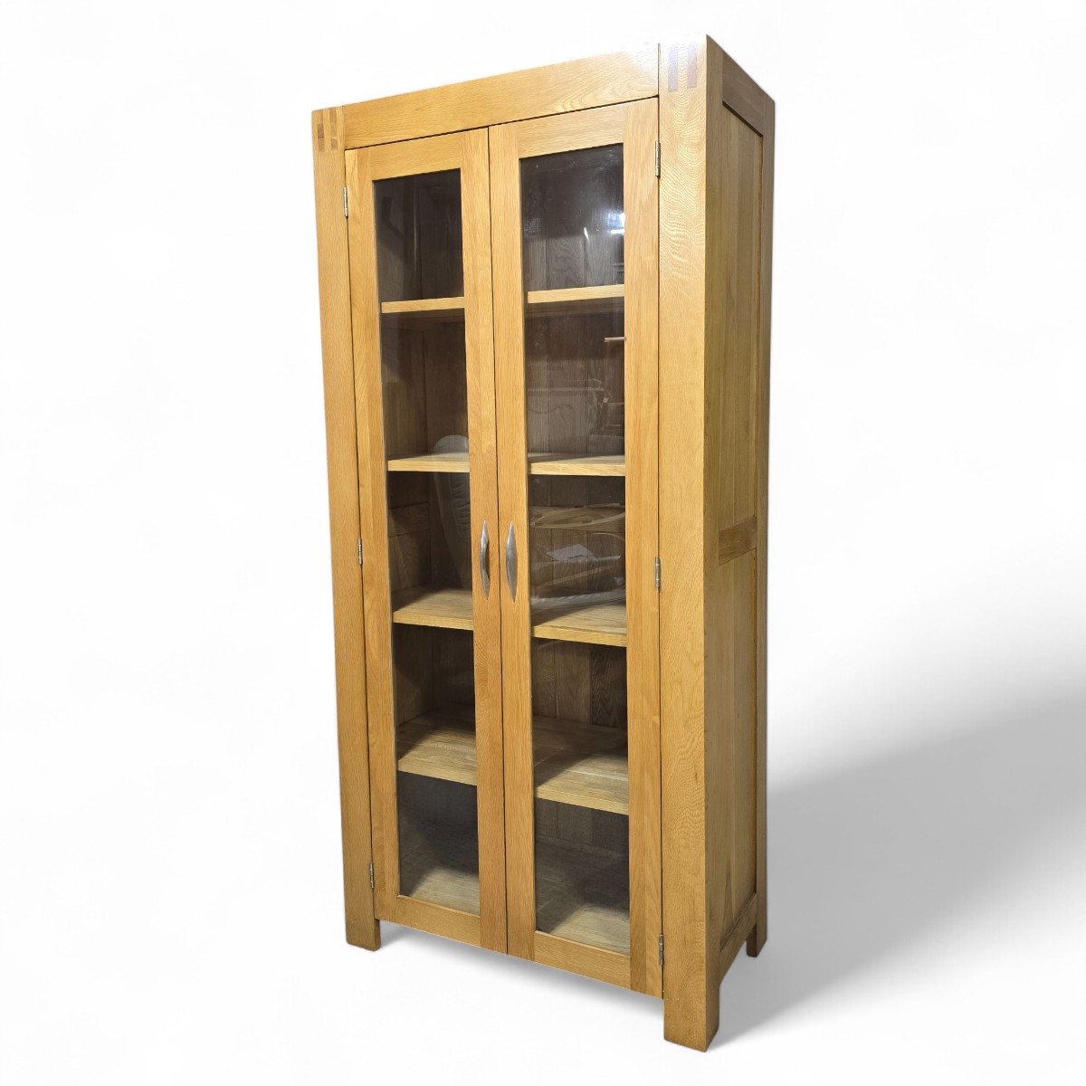 Alto display unit in medium-light oak with glass doors and adjustable shelving perfect for stylish storage solutions.