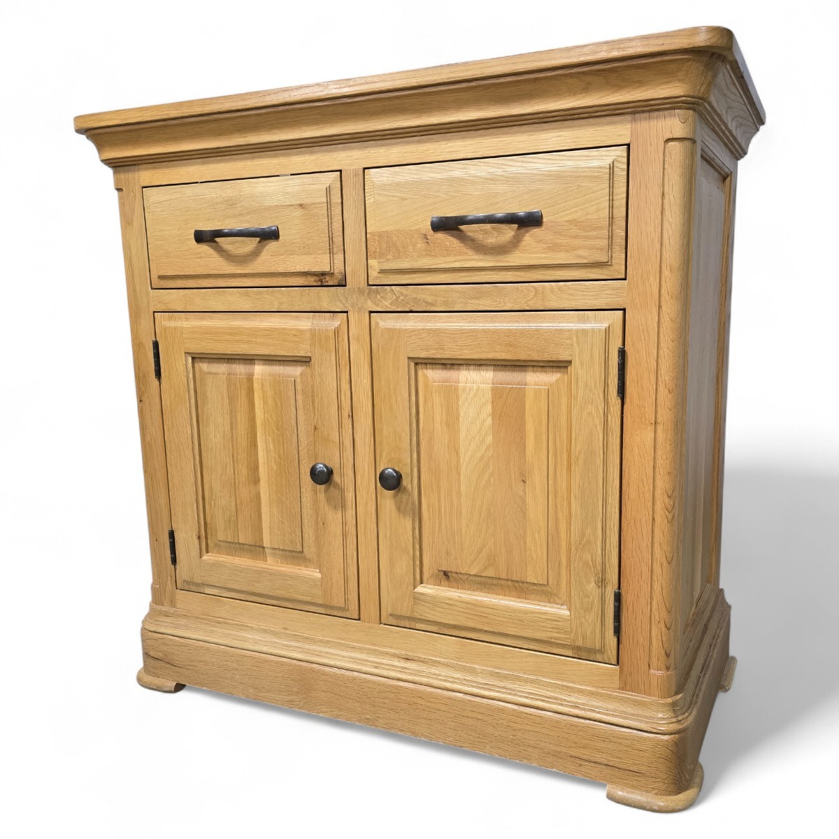 Oak FurnitureLand Canterbury small sideboard, second hand made from solid oak wood with dovetail joints and ample storage space, featuring two drawers and cupboard doors.