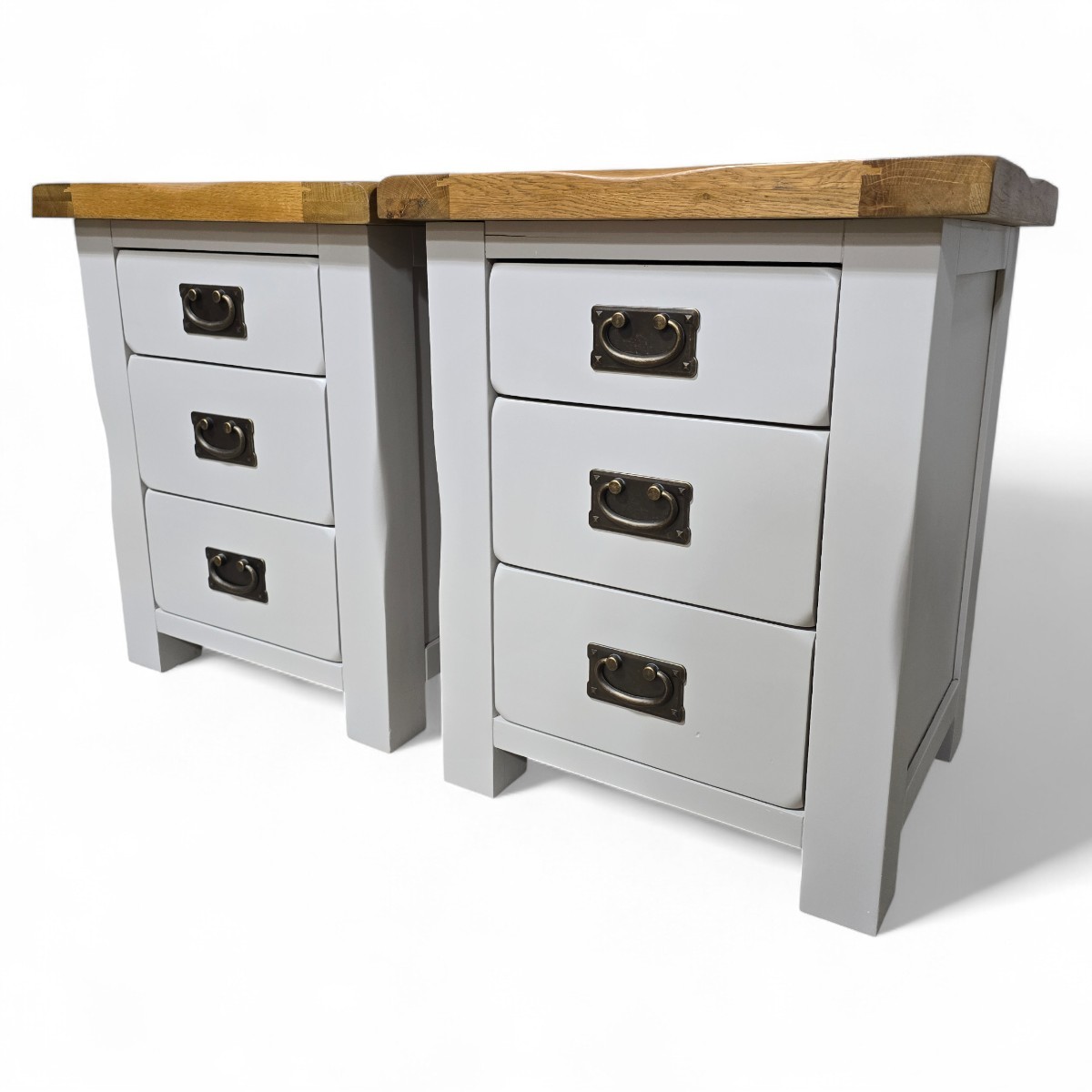 Pre-loved Kemble bedside drawers in two-tone finish with solid oak tops and metal drop handles showing premium craftsmanship details.