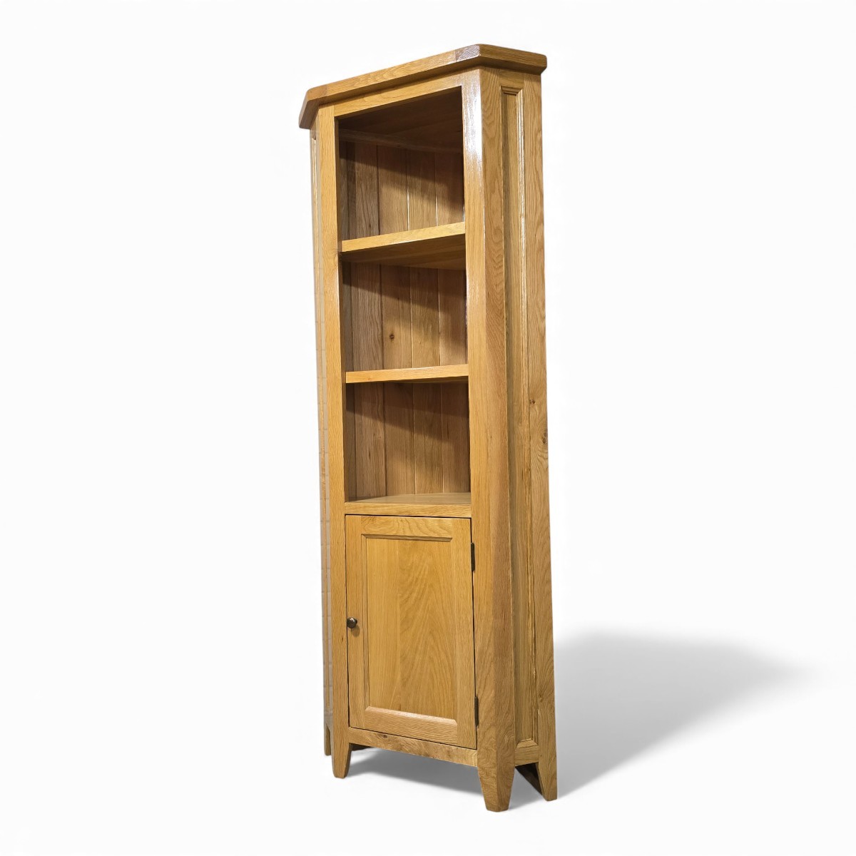 Warm medium oak corner display unit featuring three open shelves and enclosed cupboard storage—all crafted from premium solid oak.