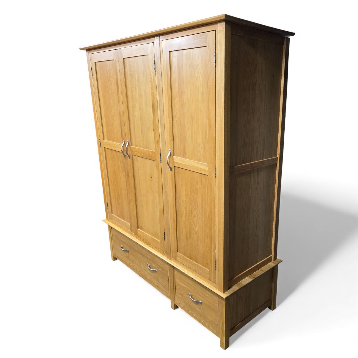 PreLoved Barker and Stonehouse triple wardrobe in medium oak finish with clean lines and subtle curves, perfect for traditional or contemporary spaces.