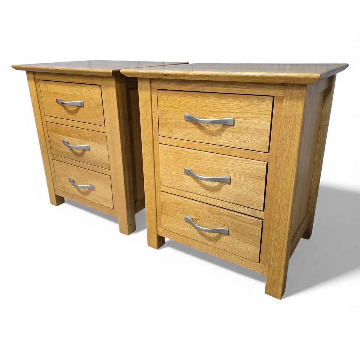 Warm medium oak bedside drawers by Barker and Stonehouse, featuring brushed-metal handles and dovetail joints, pre-loved condition.
