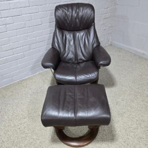 Peek inside its story... then write your own chapter with this second-hand La-Z-boy recliner and footstool set.