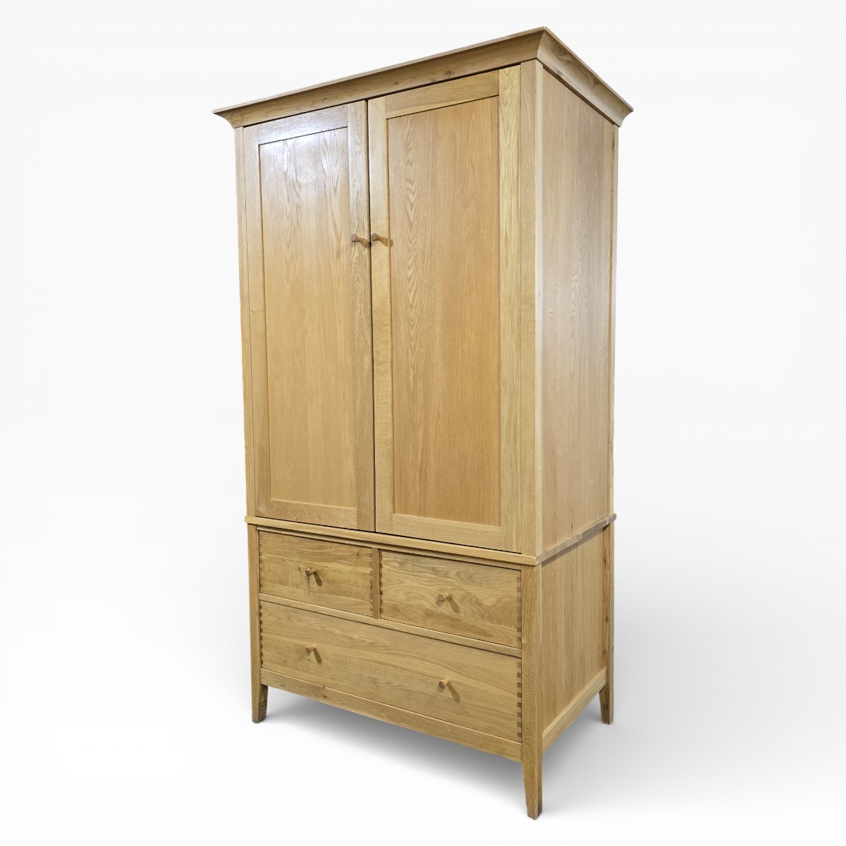 Stylish Willis and Gambier Espirit double wardrobe in solid oak and oak veneer, featuring traditional craftsmanship and a natural finish.