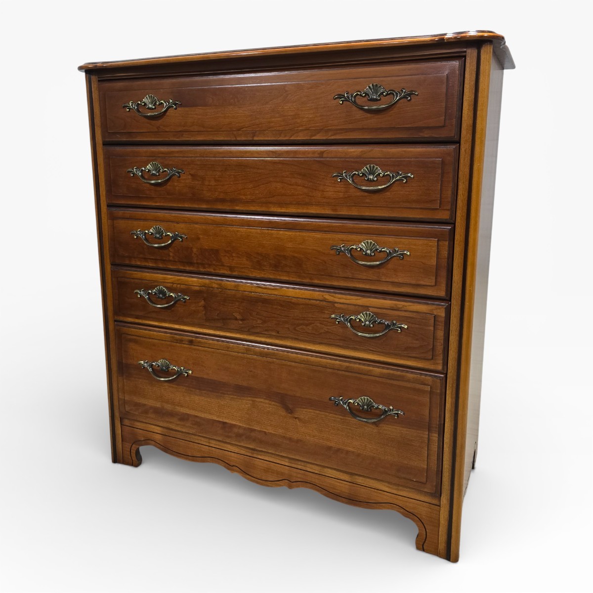 Pre-loved dark oak veneer chest of drawers with ornate brass handles and five spacious drawers.