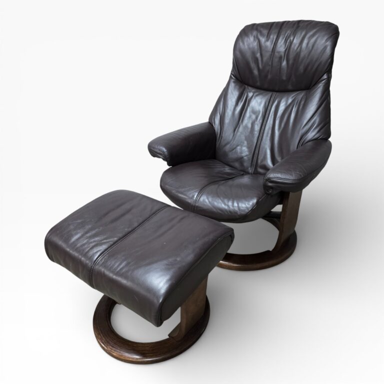 Peek inside its story... then write your own chapter with this second-hand La-Z-boy recliner and footstool set.