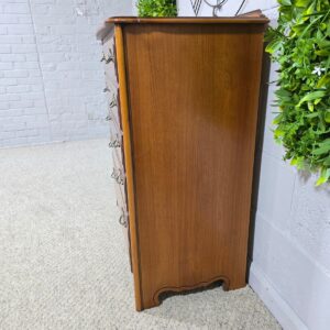 Peek inside its story... then write your own chapter with this pre-loved dark oak veneer chest of drawers.