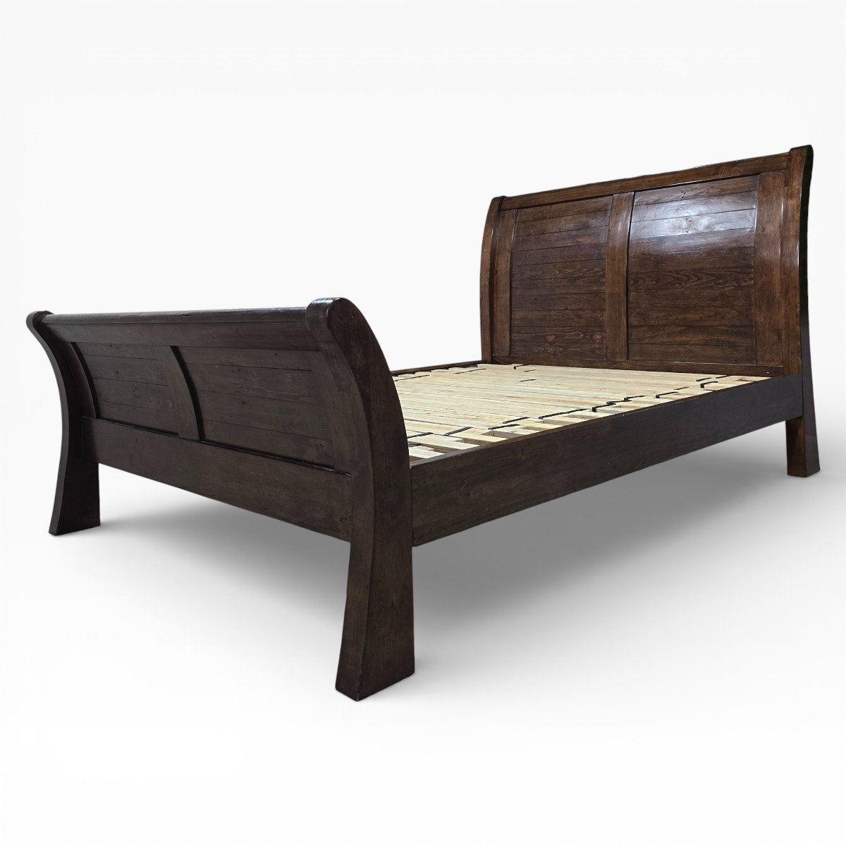 Barker and Stonehouse Navajos Panelled Bed Frame in reclaimed wood, showcasing elegant curved paneling and traditional dovetail joints.