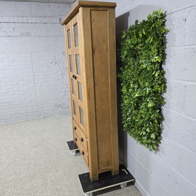 Peek inside its story... then write your own chapter with this pre-loved solid oak display unit. Peek inside its story... then write your own chapter with this pre-loved solid oak display unit.