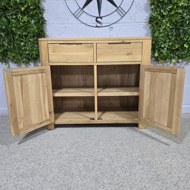 Peek inside its story... then write your own chapter with this pre-loved Oak FurnitureLand Romsey sideboard. Peek inside its story... then write your own chapter with this pre-loved Oak FurnitureLand Romsey sideboard.