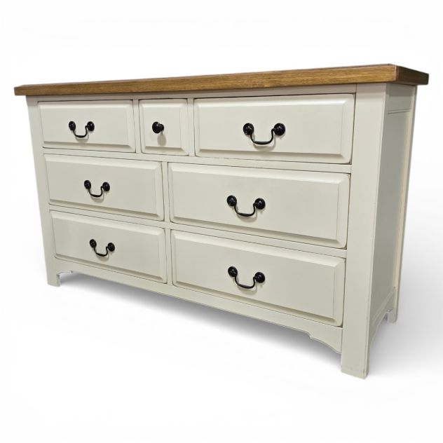Pre-loved Barker and Stonehouse chest of drawers with seven drawers, light wood top, and cream-painted body. Solid wood construction and traditional dovetail joints.