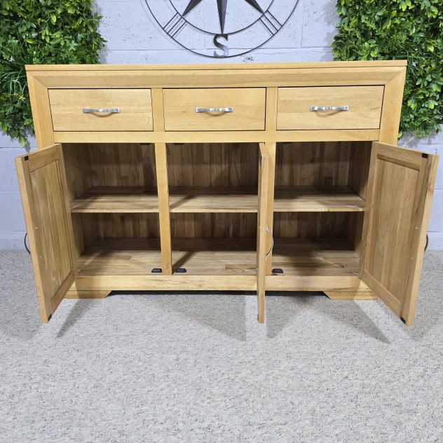 Pre-loved Bevel Natural Solid Oak Large sideboard - Save hundreds on this elegant piece Pre-loved Bevel Natural Solid Oak Large sideboard - Save hundreds on this elegant piece