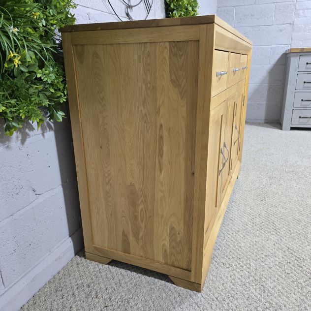 Pre-loved Bevel Natural Solid Oak Large sideboard - Save hundreds on this elegant piece Pre-loved Bevel Natural Solid Oak Large sideboard - Save hundreds on this elegant piece