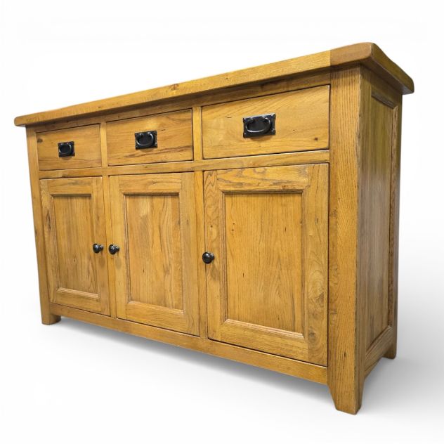 Barker and Stonehouse solid oak sideboard with medium honey finish, featuring three drawers and three cabinet doors, pre-loved and in great condition.