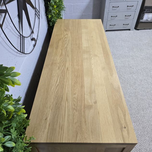 Pre-loved Bevel Natural Solid Oak Large sideboard - Save hundreds on this elegant piece Pre-loved Bevel Natural Solid Oak Large sideboard - Save hundreds on this elegant piece