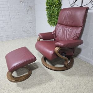 Elevate Your Space with the Himolla Zerostress 9046 Recliner and Footstool in Burgundy Leather Elevate Your Space with the Himolla Zerostress 9046 Recliner and Footstool in Burgundy Leather