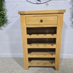 Peek inside its story... then write your own chapter with this PreLoved solid oak wine rack.