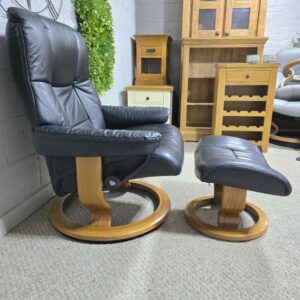 Elegant Ekornes Stressless Mayfair Recliner Armchair and Footstool in Black Leather