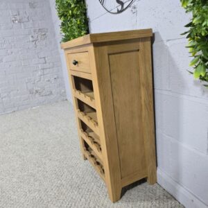 Peek inside its story... then write your own chapter with this PreLoved solid oak wine rack.