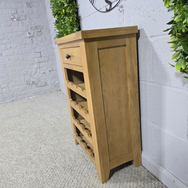 Peek inside its story... then write your own chapter with this PreLoved solid oak wine rack.