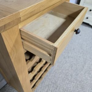 Peek inside its story... then write your own chapter with this PreLoved solid oak wine rack.