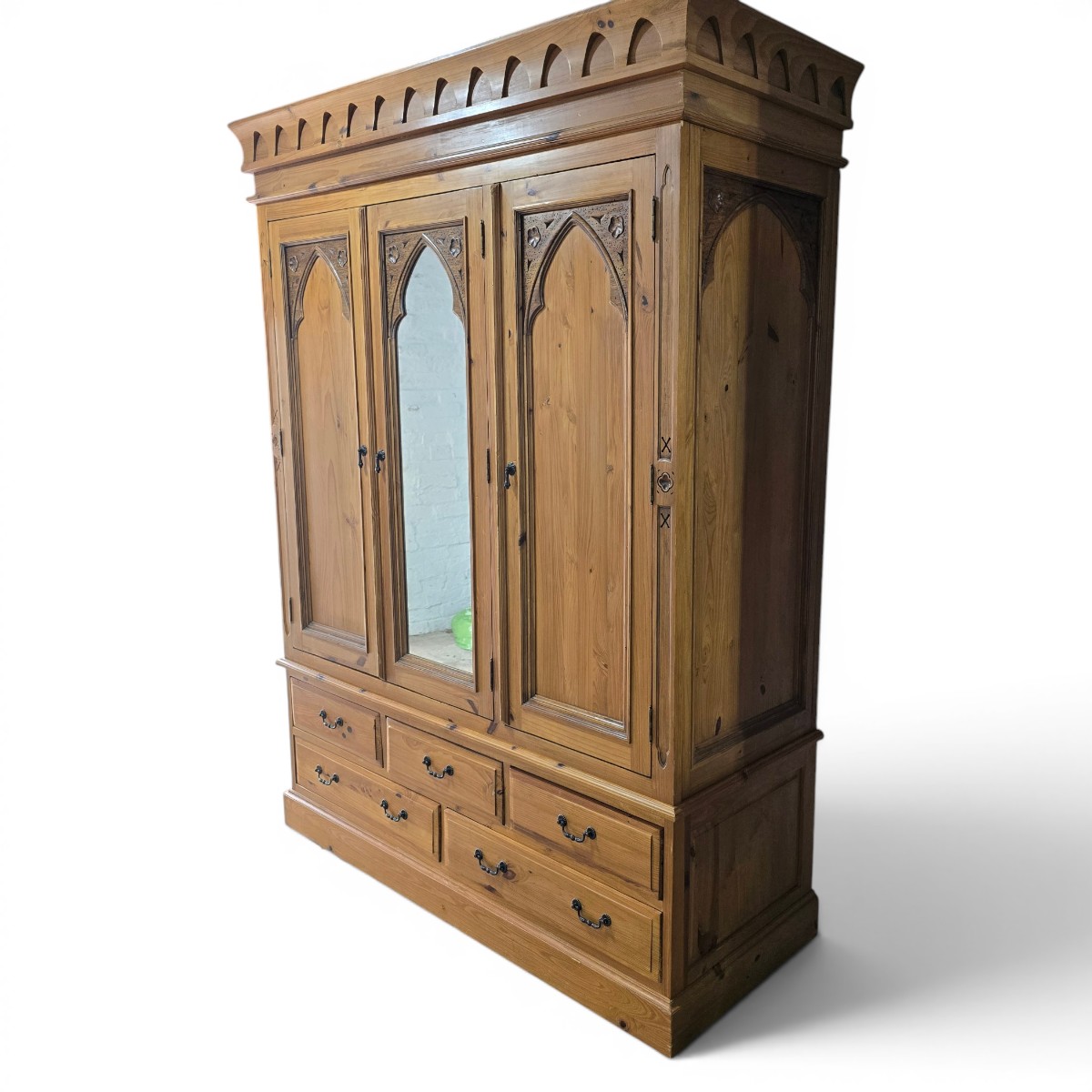 second hand barker and stonehouse triple wardrobe with carved arches and black metal handles