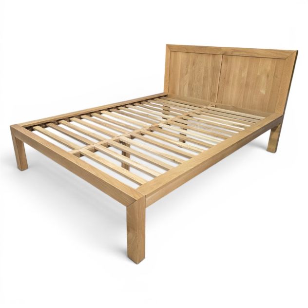 Pre-loved Oak FurnitureLand solid oak double bed frame in natural oak, showcasing minimalist design and traditional dovetail joints.