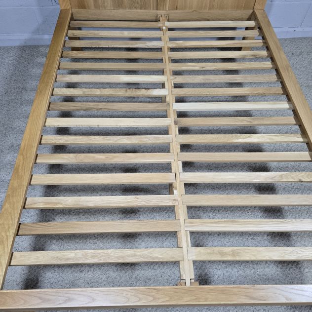 Peek inside its story... then write your own chapter with this pre-loved Oak FurnitureLand solid oak double bed frame.