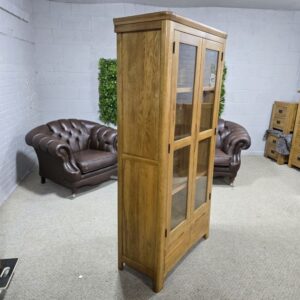 Peek inside its story... then write your own chapter with this PreLoved Oak Furniture Land Romsey solid oak display unit. Peek inside its story... then write your own chapter with this PreLoved Oak Furniture Land Romsey solid oak display unit.