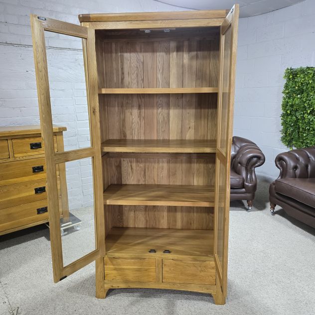 Peek inside its story... then write your own chapter with this PreLoved Oak Furniture Land Romsey solid oak display unit. Peek inside its story... then write your own chapter with this PreLoved Oak Furniture Land Romsey solid oak display unit.