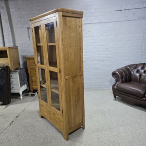 Peek inside its story... then write your own chapter with this PreLoved Oak Furniture Land Romsey solid oak display unit. Peek inside its story... then write your own chapter with this PreLoved Oak Furniture Land Romsey solid oak display unit.