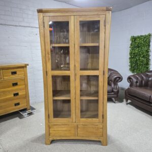 Peek inside its story... then write your own chapter with this PreLoved Oak Furniture Land Romsey solid oak display unit. Peek inside its story... then write your own chapter with this PreLoved Oak Furniture Land Romsey solid oak display unit.