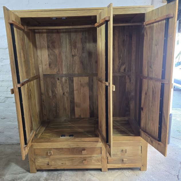 Explore the elegance of this pre-loved Oak Furniture Land Light Mantis triple wardrobe in solid mango wood Explore the elegance of this pre-loved Oak Furniture Land Light Mantis triple wardrobe in solid mango wood