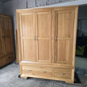Explore the Pre-Owned Oak FurnitureLand Bevel Triple Wardrobe in Solid Oak Explore the Pre-Owned Oak FurnitureLand Bevel Triple Wardrobe in Solid Oak