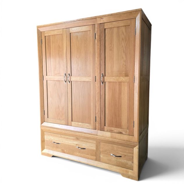 Explore the Pre-Owned Oak FurnitureLand Bevel Triple Wardrobe in Solid Oak Explore the Pre-Owned Oak FurnitureLand Bevel Triple Wardrobe in Solid Oak