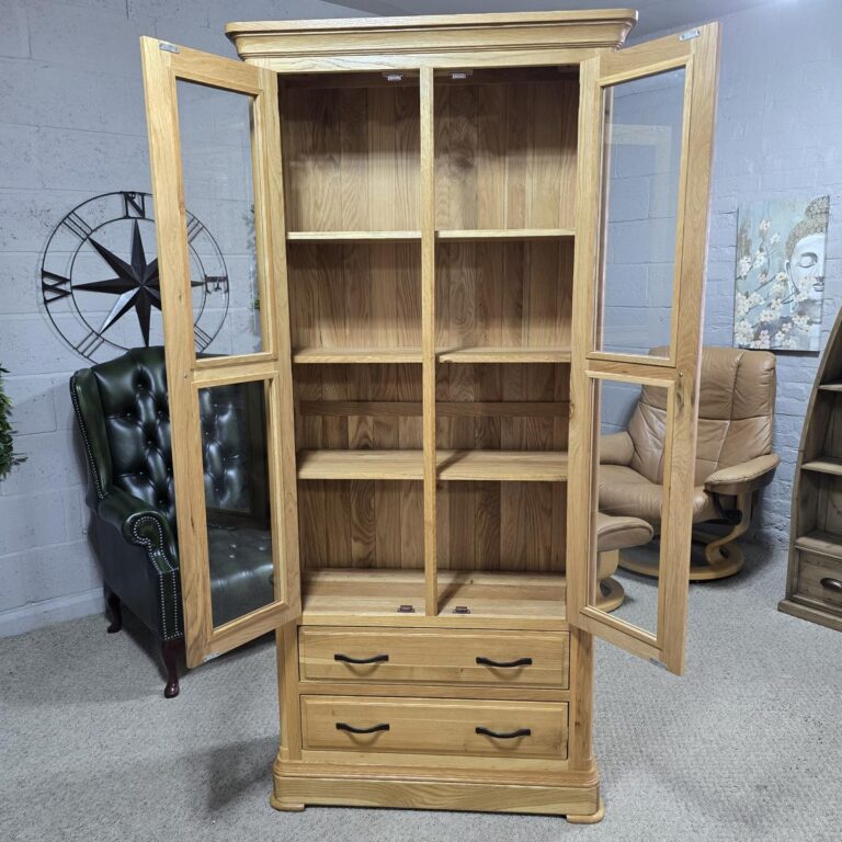 Peek inside its story... then write your own chapter with the Canterbury solid oak display unit from Oak FurnitureLand Peek inside its story... then write your own chapter with the Canterbury solid oak display unit from Oak FurnitureLand