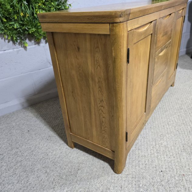 Peek inside its story... then write your own chapter with this pre-loved Oak Furniture land Orrick Solid Oak Sideboard. Peek inside its story... then write your own chapter with this pre-loved Oak Furniture land Orrick Solid Oak Sideboard.