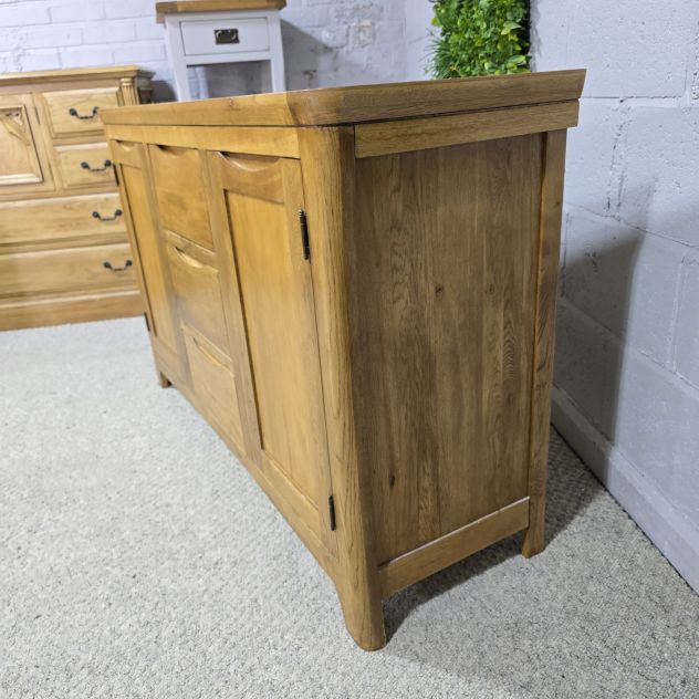 Peek inside its story... then write your own chapter with this pre-loved Oak Furniture land Orrick Solid Oak Sideboard. Peek inside its story... then write your own chapter with this pre-loved Oak Furniture land Orrick Solid Oak Sideboard.