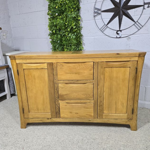 Peek inside its story... then write your own chapter with this pre-loved Oak Furniture land Orrick Solid Oak Sideboard. Peek inside its story... then write your own chapter with this pre-loved Oak Furniture land Orrick Solid Oak Sideboard.