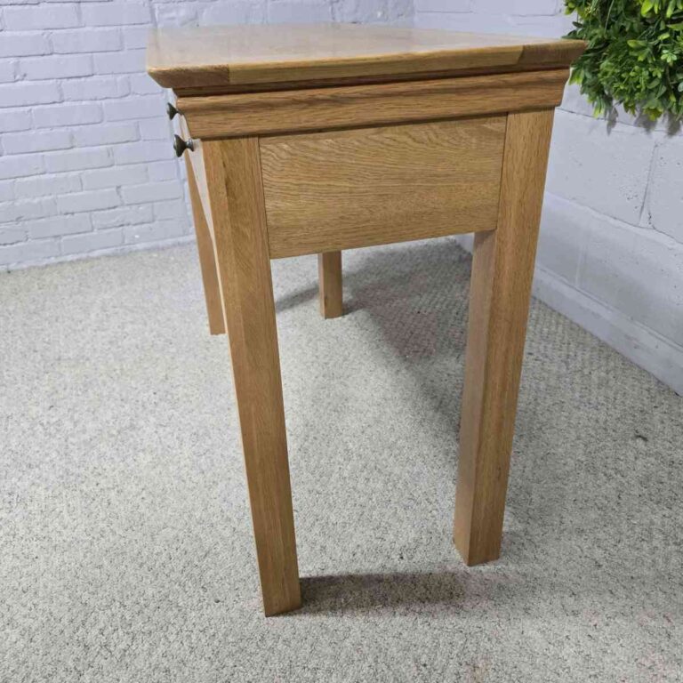 Elevate your hallway with this PreLoved Barker and Stonehouse solid oak console table. Dovetail joints and smooth pulls make it a practical and elegant choice. Elevate your hallway with this PreLoved Barker and Stonehouse solid oak console table. Dovetail joints and smooth pulls make it a practical and elegant choice.