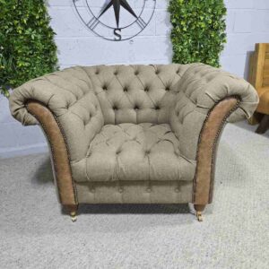 Explore the elegance of this pre-loved Barker and Stonehouse Chesterfield armchair with brass castors and deep button tufting Explore the elegance of this pre-loved Barker and Stonehouse Chesterfield armchair with brass castors and deep button tufting