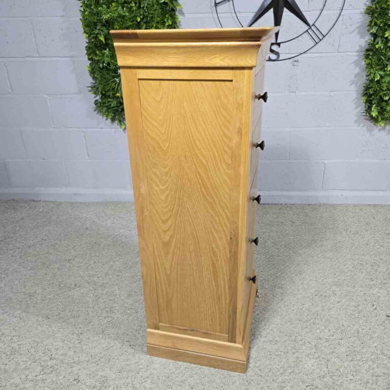 Explore the elegance of this pre-loved Barker and Stonehouse solid oak tallboy with five drawers. Perfect for stylish and practical storage. Explore the elegance of this pre-loved Barker and Stonehouse solid oak tallboy with five drawers. Perfect for stylish and practical storage.