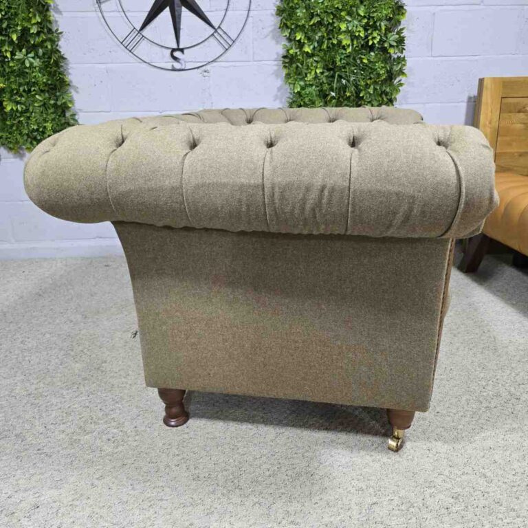 Explore the elegance of this pre-loved Barker and Stonehouse Chesterfield armchair with brass castors and deep button tufting Explore the elegance of this pre-loved Barker and Stonehouse Chesterfield armchair with brass castors and deep button tufting