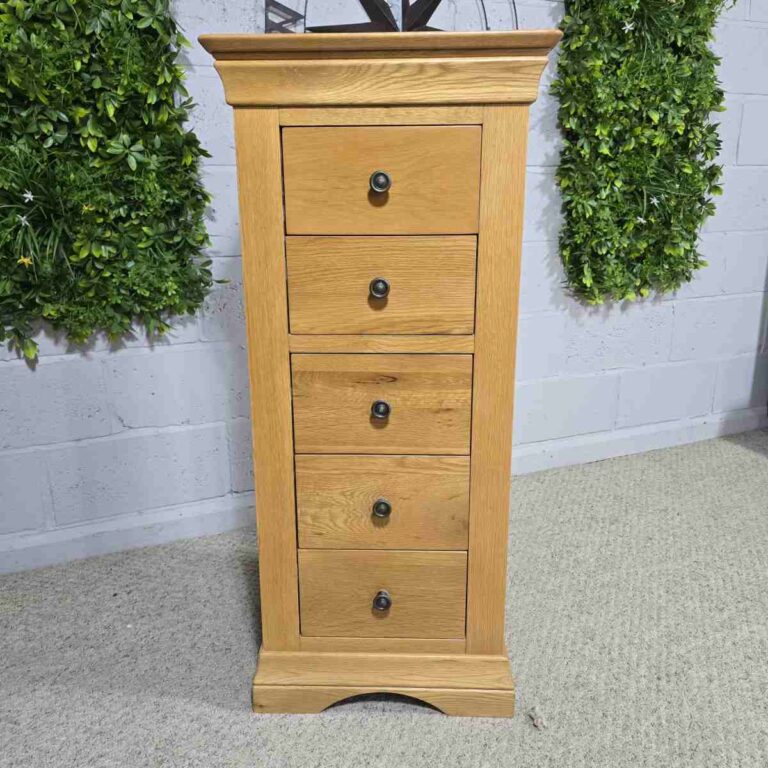 Explore the elegance of this pre-loved Barker and Stonehouse solid oak tallboy with five drawers. Perfect for stylish and practical storage. Explore the elegance of this pre-loved Barker and Stonehouse solid oak tallboy with five drawers. Perfect for stylish and practical storage.