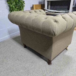 Explore the elegance of this pre-loved Barker and Stonehouse Chesterfield armchair with brass castors and deep button tufting Explore the elegance of this pre-loved Barker and Stonehouse Chesterfield armchair with brass castors and deep button tufting