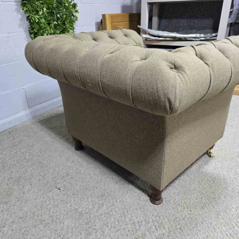 Explore the elegance of this pre-loved Barker and Stonehouse Chesterfield armchair with brass castors and deep button tufting Explore the elegance of this pre-loved Barker and Stonehouse Chesterfield armchair with brass castors and deep button tufting