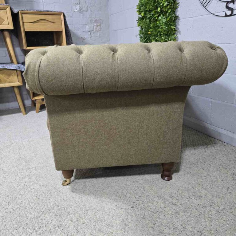 Explore the elegance of this pre-loved Barker and Stonehouse Chesterfield armchair with brass castors and deep button tufting Explore the elegance of this pre-loved Barker and Stonehouse Chesterfield armchair with brass castors and deep button tufting